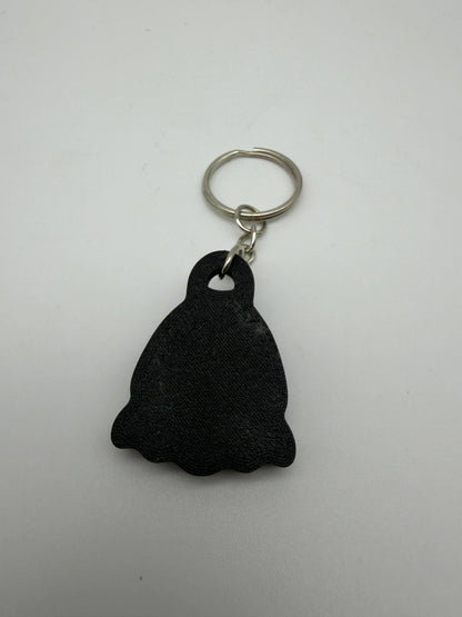 Black bell shaped keychain on a metal ring
